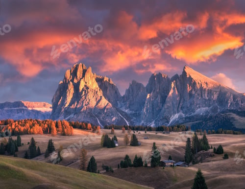 Preview: Beautiful mountains with lighted peaks and red sky at sunset
