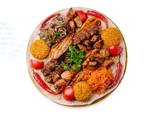 Preview: Delicious mixed grill platter with meat, rice, and fresh vegetables
