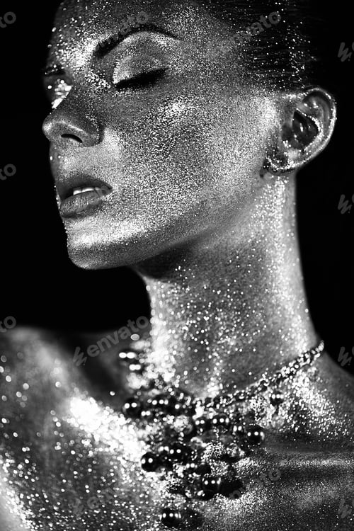 Preview: Portrait of beautiful woman with sparkles on her face