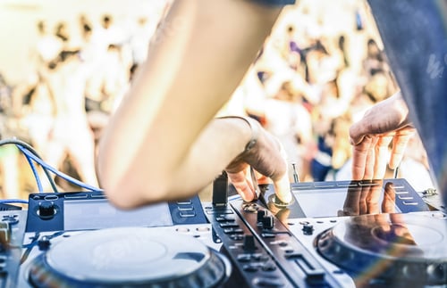 Preview: Close up of dj playing electro sound on modern cd usb player at summer beach party