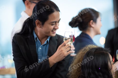 Preview: Business partners toast champagne company event celebration success