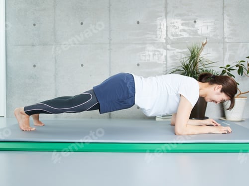Preview: Woman doing plank workout at home
