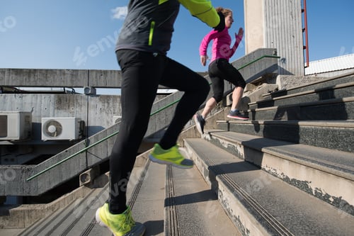 Preview: young couple jogging on steps