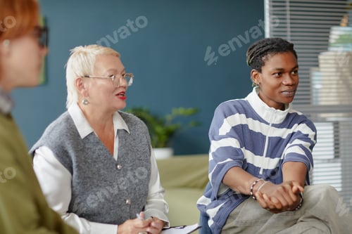 Preview: Diverse Young Adults and Middle Aged Woman Engaging in Group Discussion