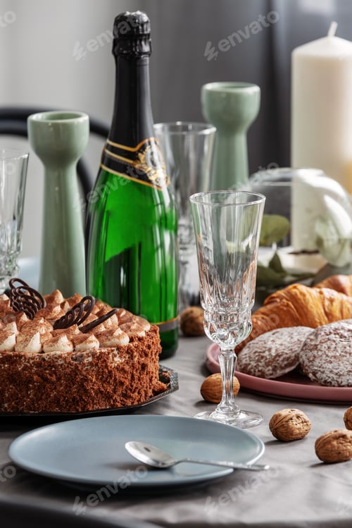 Preview: Closeup of dining table set for birthday party with champagne