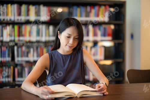 Preview: Woman read a book at library