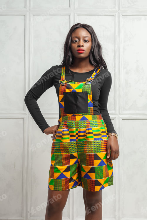 Preview: Fashion showcase with a model in colorful attire in a studio setting