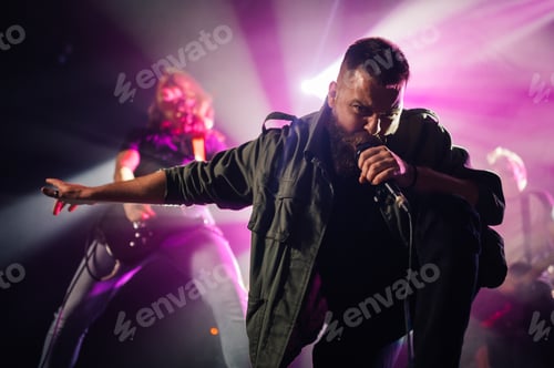 Preview: Singer performing with passion on stage during concert