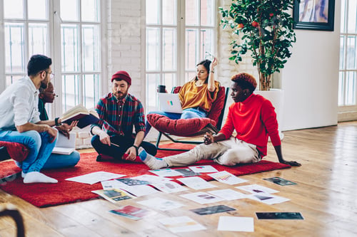 Preview: Diverse group of skilled students communicating during involved briefing