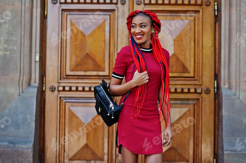 Preview: African american girl in red dress with dreadlocks