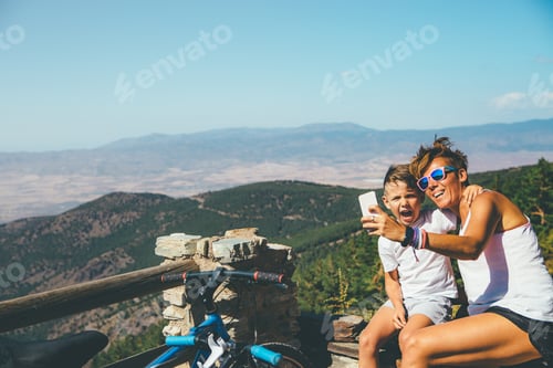 Preview: Happy mother and son at the mountain