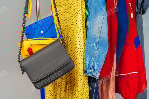 Preview: Woman's colorful different clothes on hanger close up