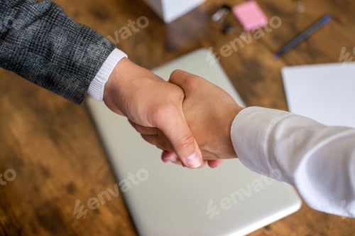 Preview: Partnership agreement. shake hands in the office, make a deal