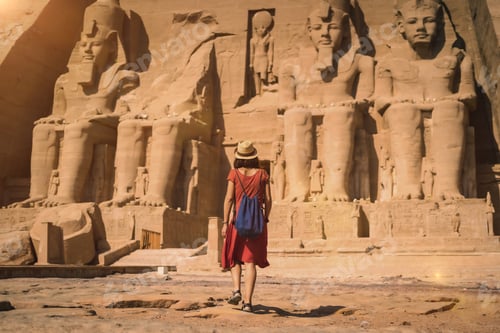 Preview: A young tourist in a red dress entering the Abu Simbel Temple in southern Egypt