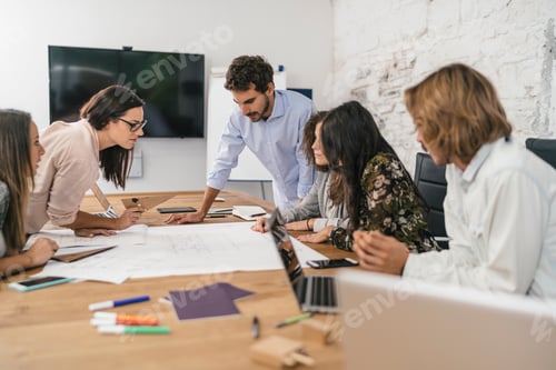 Preview: Young team of coworkers making great work discussion in modern c