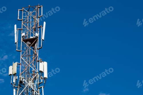 Preview: Low angle shot of a transmission tower under the beautiful cloudy sky