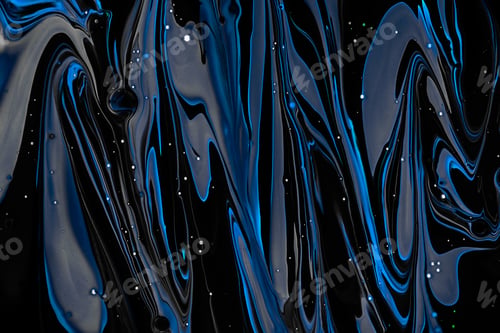 Preview: Close-up shot of thick paint of various bright colors flowing down and mixing together