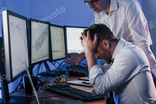 Preview: Bad luck, failure. Two stock traders working in the office with exchange technology