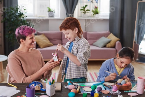 Preview: Family preparing eggs for Easter