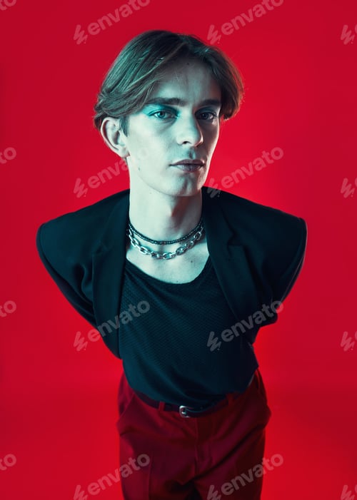 Preview: Fashion, lgbtq and portrait of a man in a studio with beauty face. stylish and classy outfit. Makeu