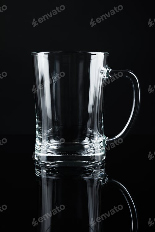 Preview: New empty beer glass on black background