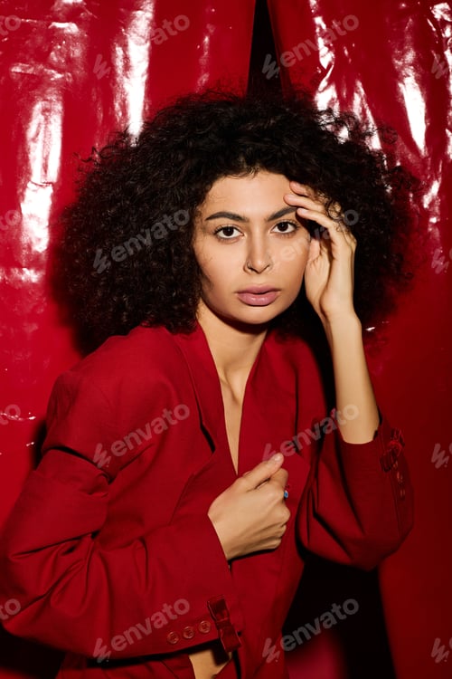 Preview: Stylish young woman celebrating love in vibrant red for Valentines Day