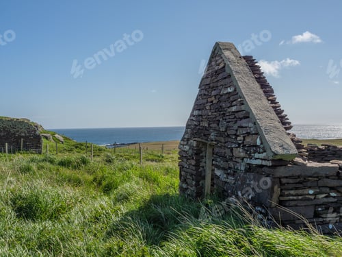 Preview: Stunning view of the Shetland Islands in Scotland, UK, blanketed in lush greenery and a tranquil sea