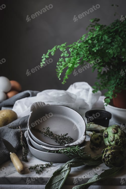 Preview: Eggs and different herbs in bowls placed on rustic table
