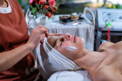 Preview: Beautiful young woman lying down on massage beds at luxury massage and spa and wellness center