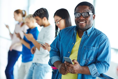 Preview: Student with smartphone
