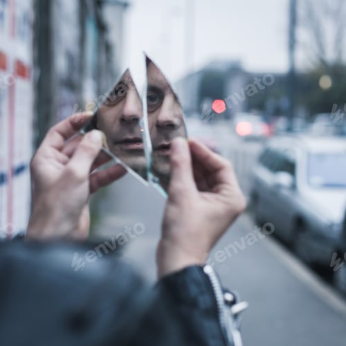 Preview: Punk guy looking at himself in a shattered mirror