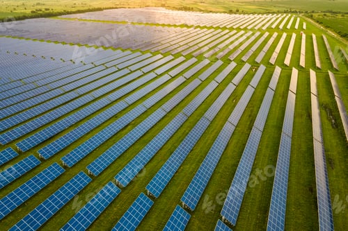 Preview: Aerial view of large sustainable electrical power plant with many rows of solar photovoltaic panels