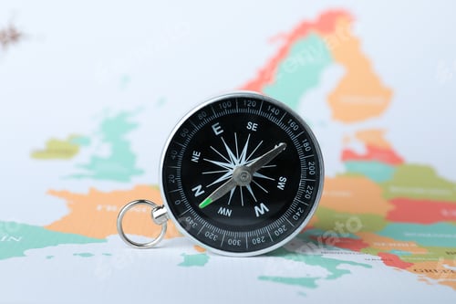 Preview: Compass on the background of the world map.