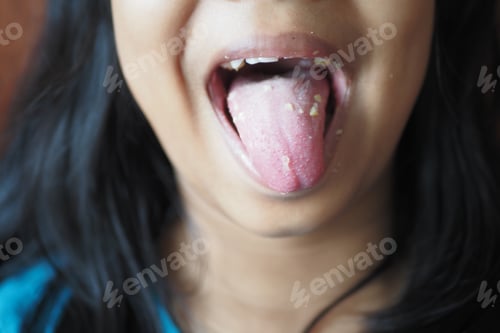 Preview: child shows his tongue closeup