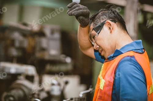 Preview: Tired fatigue exhausted engineer feel sick worker from hard working in factory sweat hot bad airflow