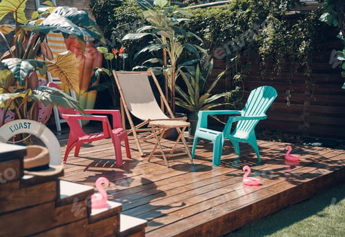 Preview: Shot of colored chairs on the wooden floor among the green plants