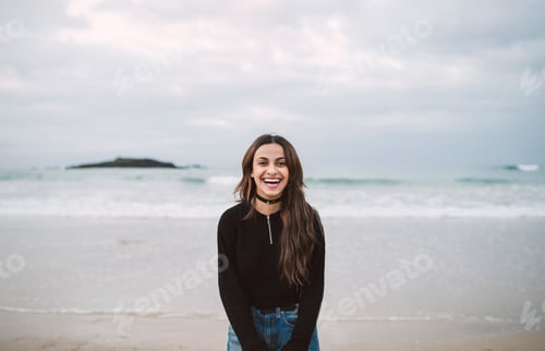Preview: Portrait of laughing young woman on the beach