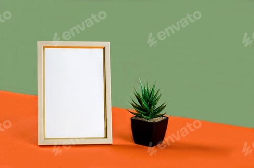 Preview: Blank white vertical photo frame on orange and green background.