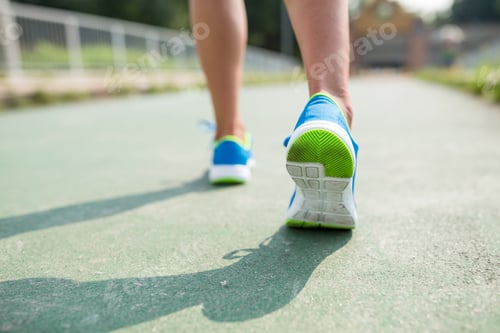 Preview: Woman training marathon in a city