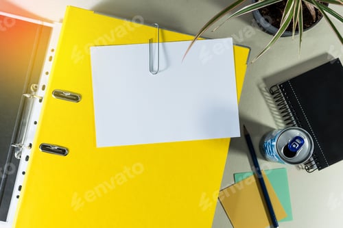 Preview: Top view of office folder with copy space and other office supplies on desk - education concept
