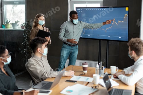 Preview: Colleagues having meeting in boardroom, businessman giving speech
