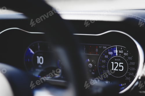 Preview: Closeup shot of a car dashboard with a speedometer