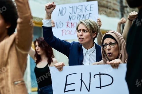 Preview: Multi-ethnic crowd of people protesting against racism on the streets.