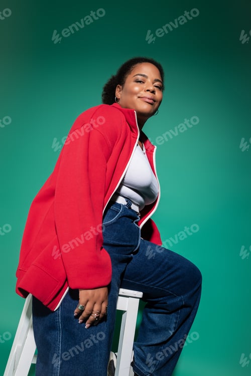 Preview: Plus-size African American woman models autumn fashion in a chic studio