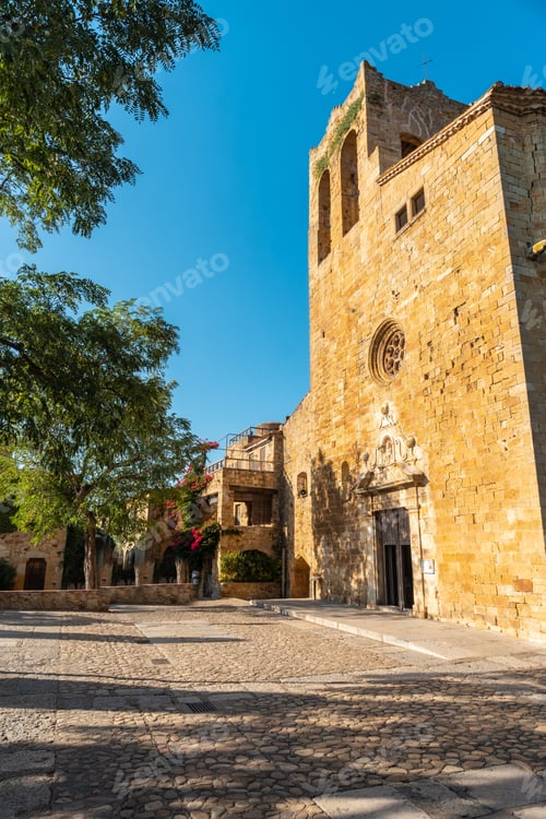 Preview: Church of Pals medieval village, streets of the historic center at sunset, Girona