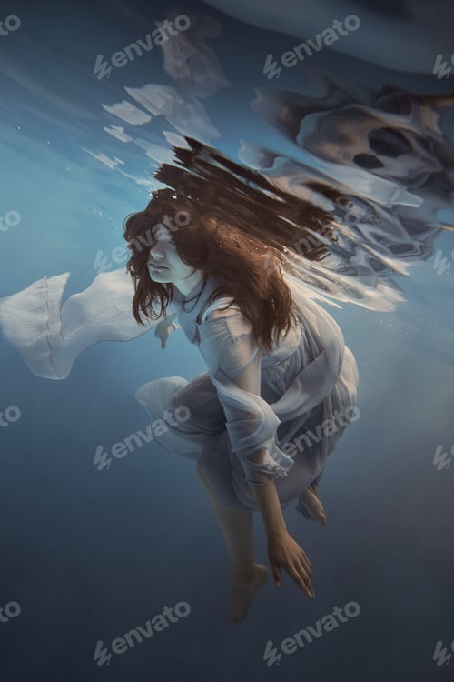 Preview: Portrait Of A Girl In A Blue Dress Under Water