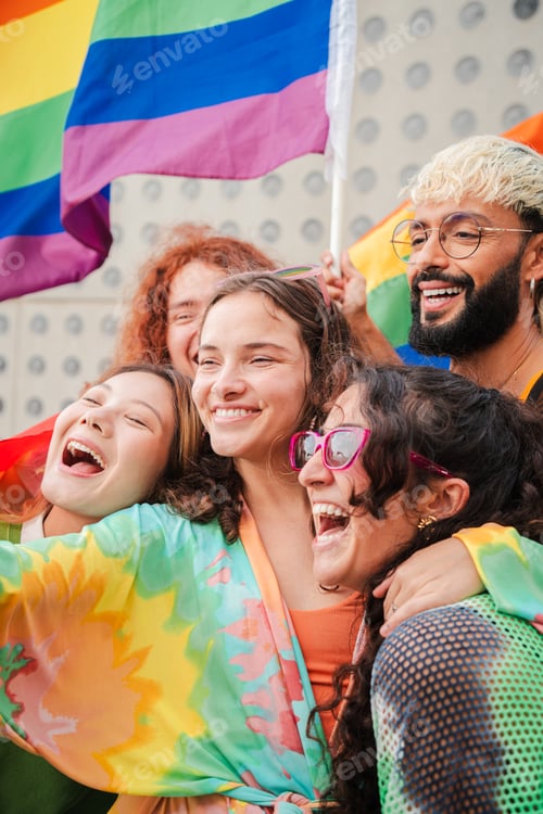 Preview: Vertical portrait of a group of LGBT poeple having fun celebrating the gay pride day with a rainbow