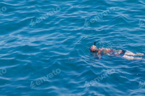 Preview: Spearfisherman swims in sea