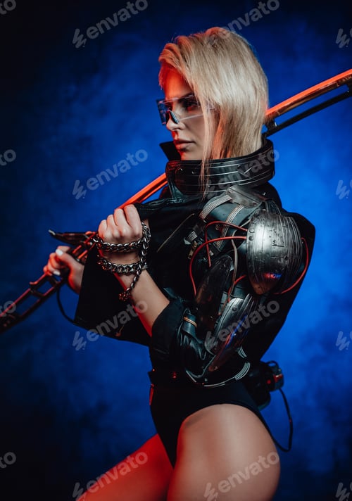 Preview: Young and attractive woman with sword poses in dark background
