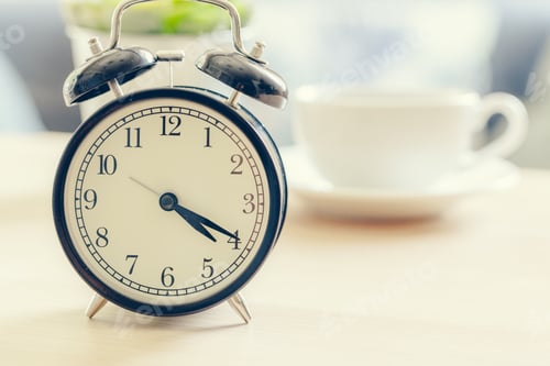 Preview: Morning sun. Alarm clock on a beautiful background